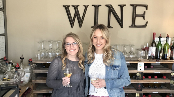 Two Girls Drinking Wine